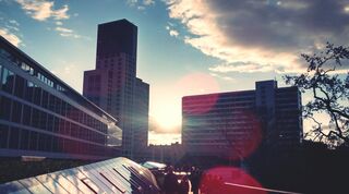 Landscape image of building in sunrise