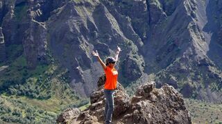 Nina Shah at the top of a mountain