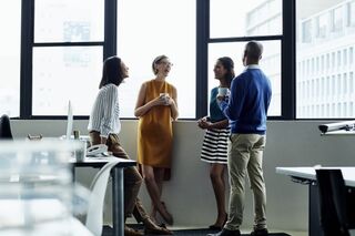 A group of employees stand together