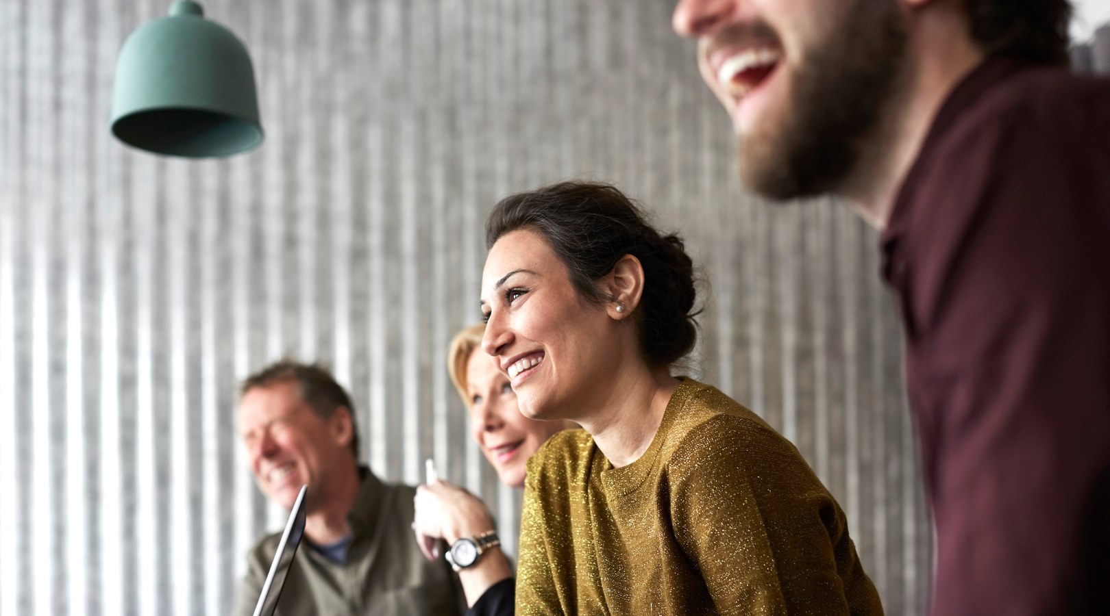 Three people in an informal meeting 