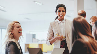 Image of two people interacting in an office environment